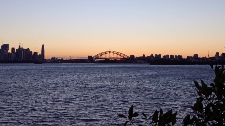 Sydney Harbour Bridge with Boat Traveling During Sunset