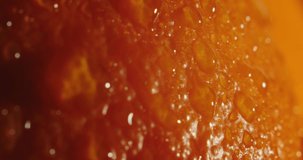Ripe orange peel. Orange peel. The orange peel is moist. Drops of water on the peel of an orange