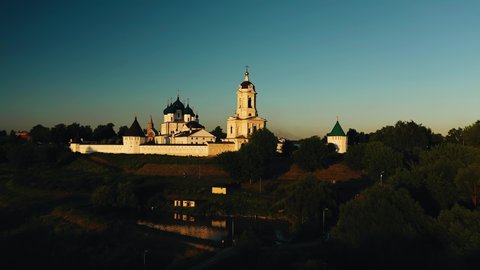 Shooting a white christian church at sunset. The temple is consecrated by the beautiful evening sun