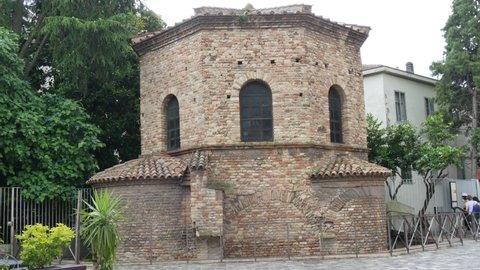 Ravenna, Italy JUNE, 5, 2016 Exterior static view of Arian Baptistery with presence of pigeon flight. 