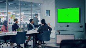 Businesspeople do Video Conference Call with Green Screen TV in Office Meeting Room. Diverse Team of Creative Entrepreneurs at Big Table have Discussion. Specialists work in Digital e-Commerce Startup - Powered by Shutterstock - Get 15% off with code: PIKWIZARD15