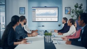 Multi-Ethnic Office Conference Room Meeting: Diverse Team of Managers, Executives Talk, Uses Wall TV with Big Data Analysis, Charts and Infographics. Businesspeople Investing in e Commerce Startup - Powered by Shutterstock - Get 15% off with code: PIKWIZARD15