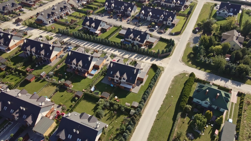 Modern residential district in Europe town, aerial view. Residential neigborhood, bird eye view. City streets with luxury house buildings and parked car
