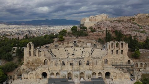 Aerial drone video from iconic ancient theatre of Herodes Atticus near Acropolis hill, Athens historic centre, Attica, Greece                              