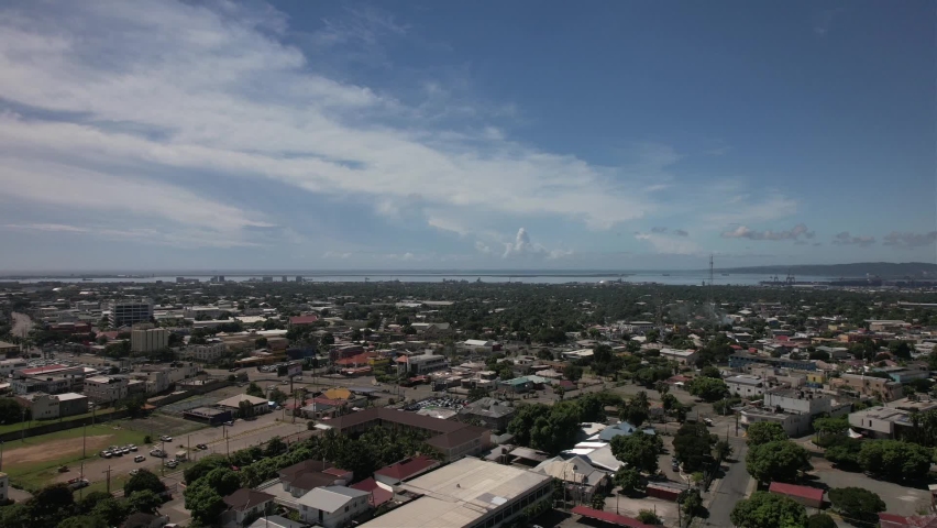 Aerial view of Kingston city, living houses, government buildings and mountains.