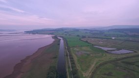 Wetlands and meadows in RSPB Exminster and Powderham Marshe from a drone, Exeter, Devon, England