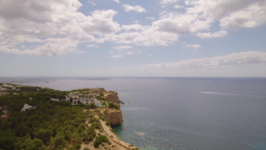 Aerial view of beautiful island of Ibiza coast with boats, and increadible landscapes. Spain.