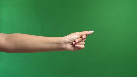 Close Up Of Woman's Hand Snapping Her Finger Doing The Hand Gesture Isolated On Green Screen Background
