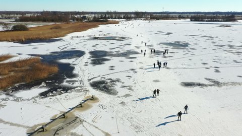 Aerial fromwinter fun on a frozen Bergumer lake in Friesland the Netherlands