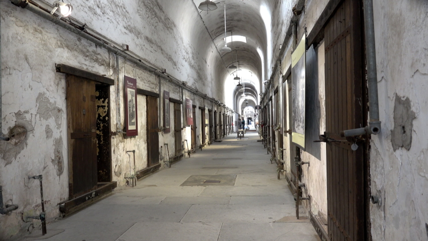Prison cell block at Eastern State Penitentiary from right side of aisle. Royalty-Free Stock Footage #1080904418