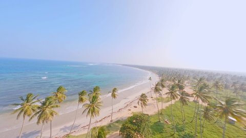 Aerial fpv racing drone over Los Coquitos beach, Dominican Republic วิดีโอสต็อก