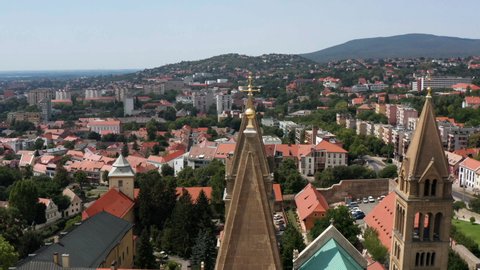 Crosses And Towers Of The Famous Pecs Cathedral Situated In The City Of Pecs In Hungary. aerial orbit