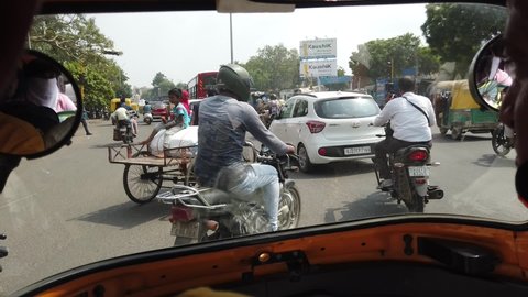 circa 2021 Delhi ,India,View from the inside of an auto-rickshaw as a passenger in Mumbai and Delhi, India,Delhi auto rickshaw view,cityscape in India show transportation Moto Rickshaw,