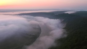 Shooting from a drone of a foggy morning landscape of a Dniester River. Cinematic aerial shot. Location place Dnister canyon, Ukraine, Europe. Discover the beauty of earth. Filmed in 4k, drone video.