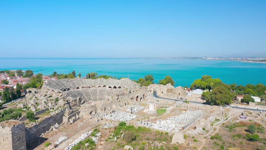 Roman theater in the city of Side. Tyukhe Temple. Agora. Turkey. Ruins of the ancient city of Side. View from above. Ancient Side city theatre, Antalya. Side view onto antique theater in ancient city
