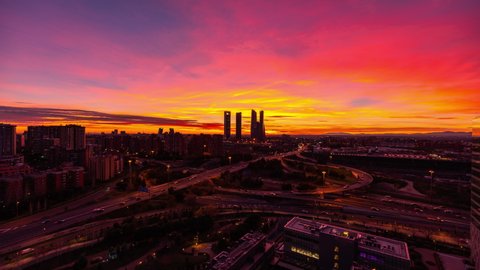 Madrid Skyline and motorway traffic Timelapse day to night sunset 