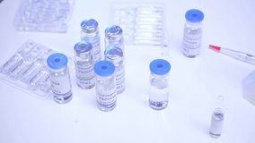 Cropped view of scientist taking coronavirus vaccine in laboratory