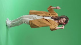 Full Body Of Asian Woman Listening To Music With Headphones And Dancing In The Green Screen Studio
 - Powered by Shutterstock - Get 15% off with code: PIKWIZARD15