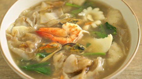 Wide Rice Noodles with Seafood in Gravy Sauce - Asian food style