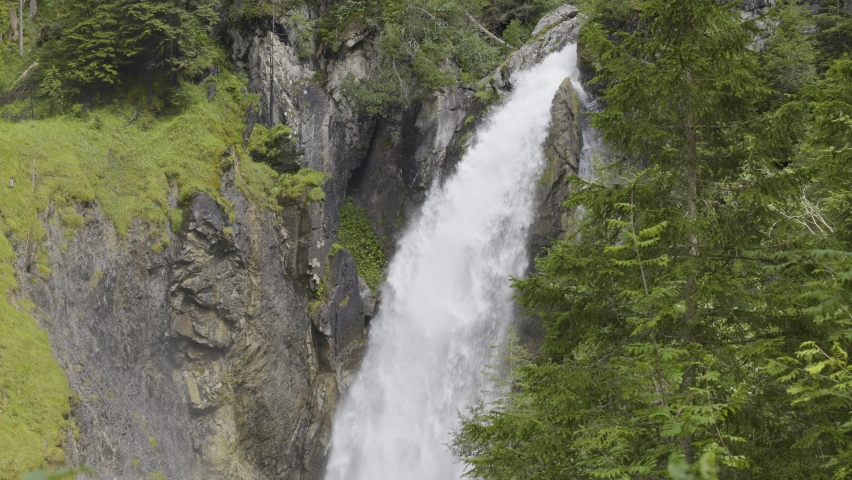 Waterfall in the mountains. Waterfall near Rosenlaui Glacier Gorge. Berner Oberland, Canton Bern, Switzerland