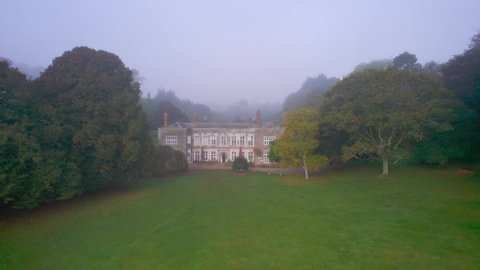 Foggy view for Cockington Court from a drone, Torquay, Devon, England, Europe