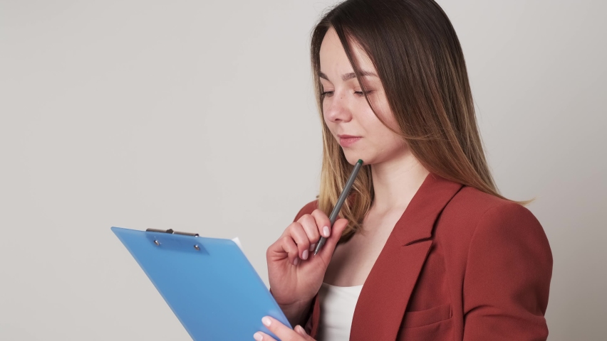 Creative young woman taking notes in paper notebook Royalty-Free Stock Footage #1080954017