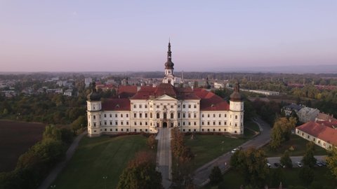 Slow flight of a drone to the historic monastery in Olomouc at sunset in the Czech Republic in autumn