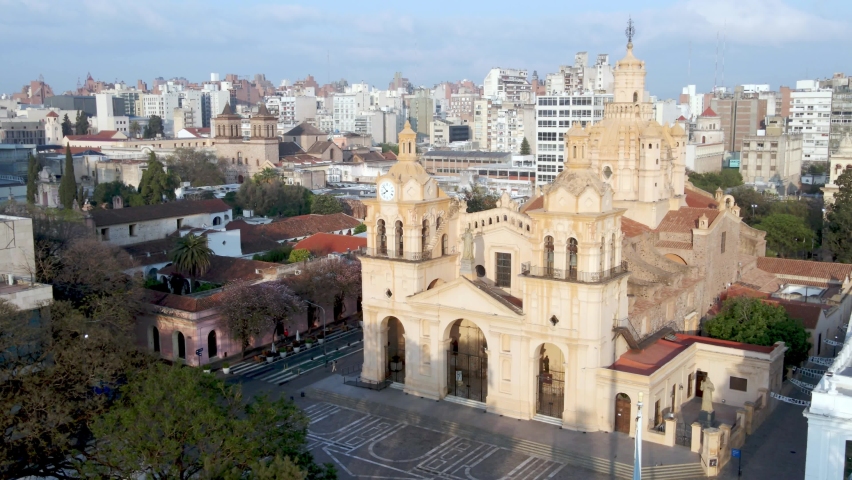 Roman Catholic Cathedral of Cordoba showered in sunlight, drone dolly in