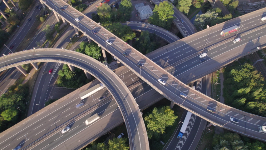 Vehicles Driving Navigating a Spaghetti Interchange Road System Royalty-Free Stock Footage #1080966107