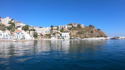 Ikaria, Greece - 20.08.2020: Marvelous typical Greek fisher port with Evdilos village behind in Ikaria