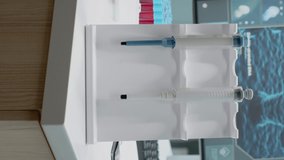 Vertical video: Close up of chemistry pipette in research laboratory with nobody at desk. Medical instruments for development on workplace table at clinical experiment place used in scientific