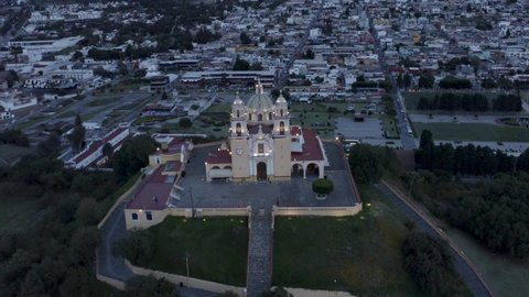 Aerial view during sunset of the City of Cholula, Puebla and the Church of the Sanctuary of Our Lady of Remedies Cholula