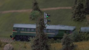 Mini Train Station Modelling. Model of Railway Station With Moving Train. Model Electric Locomotive Moving on Model Railroad. City in Miniature With Working Signal Lights. - Powered by Shutterstock - Get 15% off with code: PIKWIZARD15