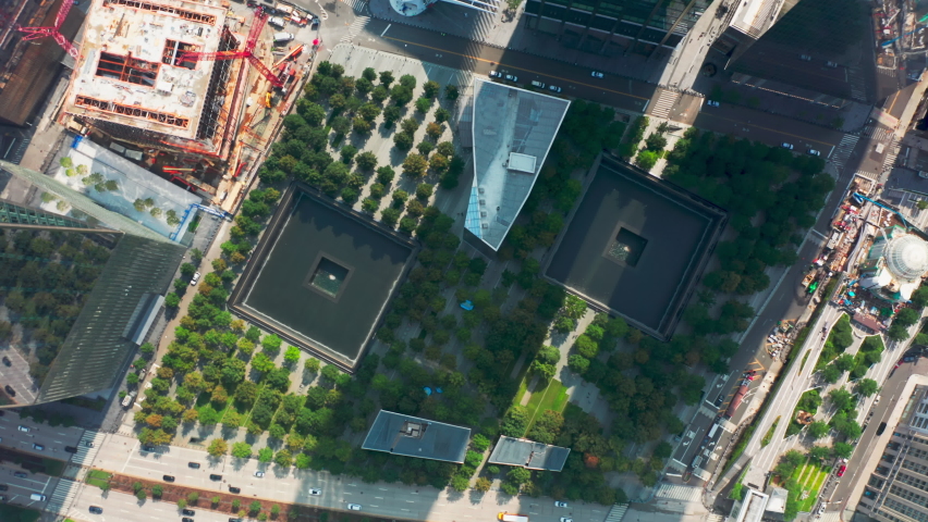 Overhead view on green park and fountains dedicated to the 911 memorial in lower Manhattan area of New York city, USA. Aerial 4K World Trade Center, 911 Museum in memory of September 11, 2001 tragedy Royalty-Free Stock Footage #1081004885