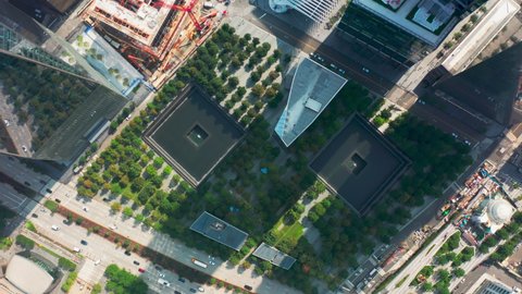 Overhead view on green park and fountains dedicated to the 911 memorial in lower Manhattan area of New York city, USA. Aerial 4K World Trade Center, 911 Museum in memory of September 11, 2001 tragedy