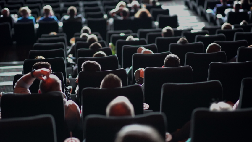 Audience in a movie theater watching a film - big cinema | Shutterstock HD Video #1081010345