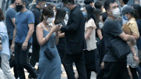 Slow motion of unrecognized people wearing medical face mask in downtown. - Powered by Shutterstock - Get 15% off with code: PIKWIZARD15