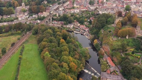 Aerial drone footage of the beautiful village of Knaresborough in North Yorkshire in the winter time showing the famous Knaresborough Viaduct and train tracks and the River Nidd