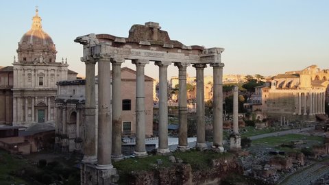 Hdr view of the Roman Forum with Septimius Severus triumphal arch and Temple of Saturn, church dome and city skyline in ancient downtown of Rome