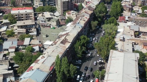 Yerevan, Armenia 09.04.2020 Aerial view streets in Yerevan, capital of Armenia. Cars, trolleybus, people on street in center( kentron) of Armenia. There are modern and old style buildings. 
