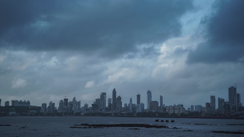 4K Day  to Night Time-lapse of Mumbai city in Maharashtra , India. As seen Form the Marine Drive 