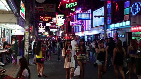 THAILAND, PATTAYA, MARCH 31, 2014: Walking Street is red-light district with many restaurants, go-go bars and brothels, that draws people, primarily for night life and sexual entertainments