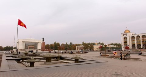 Bishkek, Kyrgyzstan - October 21, 2021: Bishkek city central square with Kyrgyzstan national flag. The capital city of Kyrgyz Republic