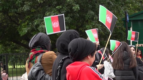 London , London , United Kingdom (UK) - 08 28 2021: Afghan women wave flags at a protest against the rise of the Taliban in central London, UK. 28.08.21