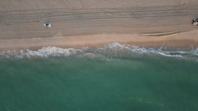 Top down aerial drone view of the ocean and sand beach. Miami Beach, Florida