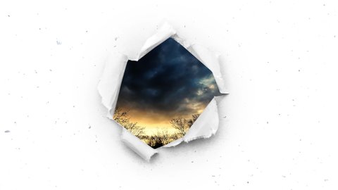 A hole with torn edges in the snowy sky through which you can see the beautiful summer sky at sunset. The concept of hope, change for the better. Creative 4k time-lapse and slow motion video.