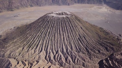 Aerial view of Mount Batok in East Jawa, Indonesia. Volcano crater next to Mount Gunung Bromo, active volcano, Tengger Semeru National Park. 4K video. Wonderful Indonesia.