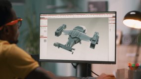 Black man using computer and creating 3D model of futuristic aircraft for videogame or movie while working from home - Powered by Shutterstock - Get 15% off with code: PIKWIZARD15