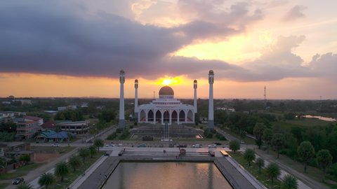 Mosque Aerial view flying Beautiful grand Masjid Ramadan evening colorful sunrise India. best 4K. Landscape drone camera clouds sunset or sunrise golden sky .