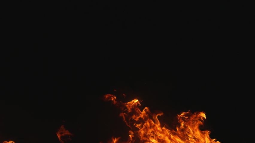 Fire and flames from burning rubber on dark background. Heat footage for templates and alpha channel editing pattern. Empty copy space for text, title or logo design. Place for ads in loop of fire. Royalty-Free Stock Footage #1081072298
